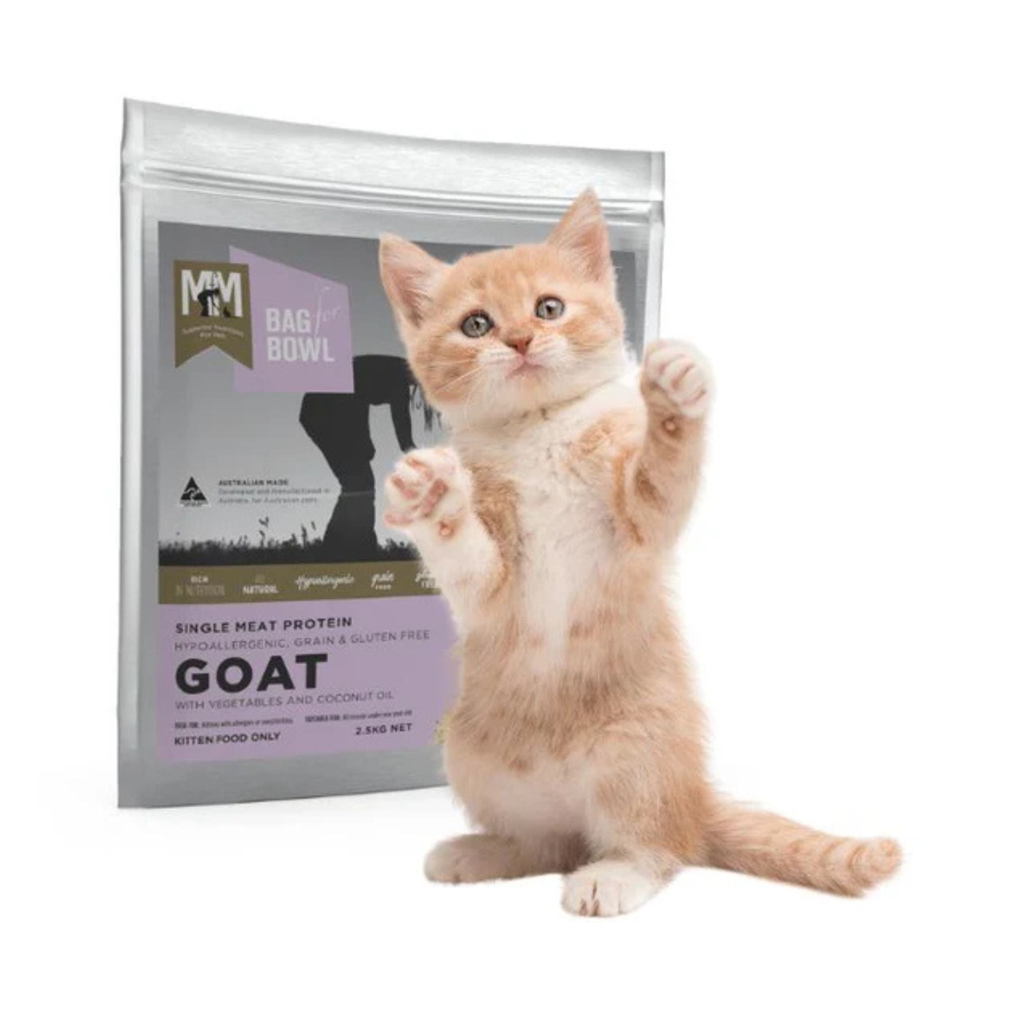 Kitten standing next to a bag of MfM goat kitten food on a white background