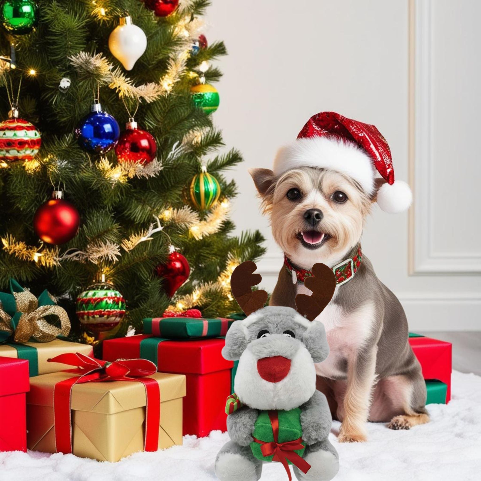 A happy dog sitting with the Prestige Snuggle Pal Festive Dog Toy near a decorated Christmas tree, capturing holiday cheer and pet joy.