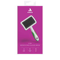 Andis Medium Firm Slicker Brush for dogs, inside branded packaging with listed features and benefits.