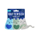 Close-up of a three colourful catnip cat toys attached to Battersea branded packaging.