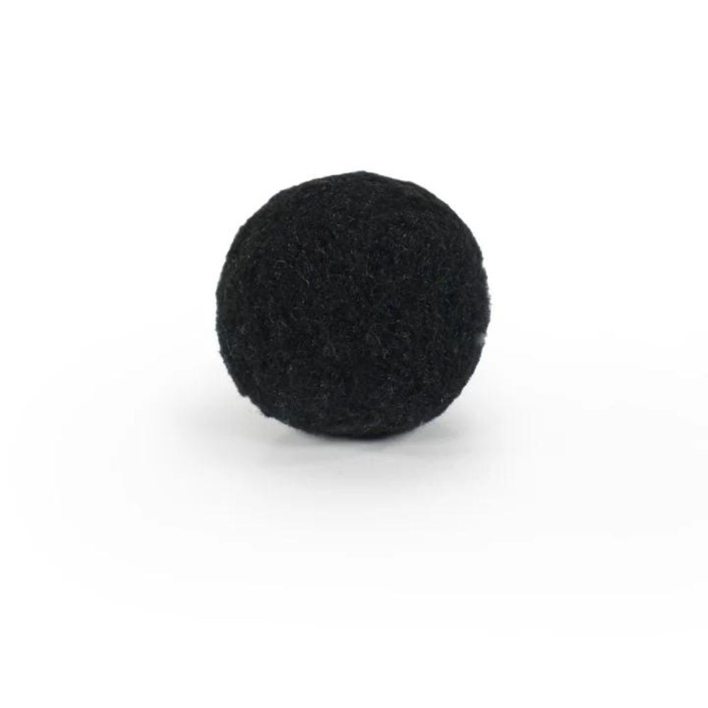 Close-up image of a black Battersea Pounce Cat Ball feline toy. 