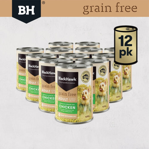 Multiple cans of Black Hawk chicken grain-free dog food with a '12 pk' pack on a light grey background.