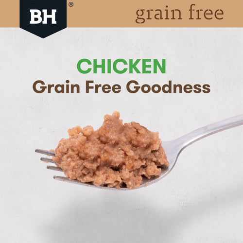 Spoonful of grain-free chicken dog food with Black Hawk brand logo on a white background
