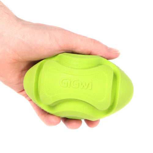 GiGwi G-Foamer Rugby Ball in hand, showing its lightweight design and ideal size for interactive fetch games with dogs.