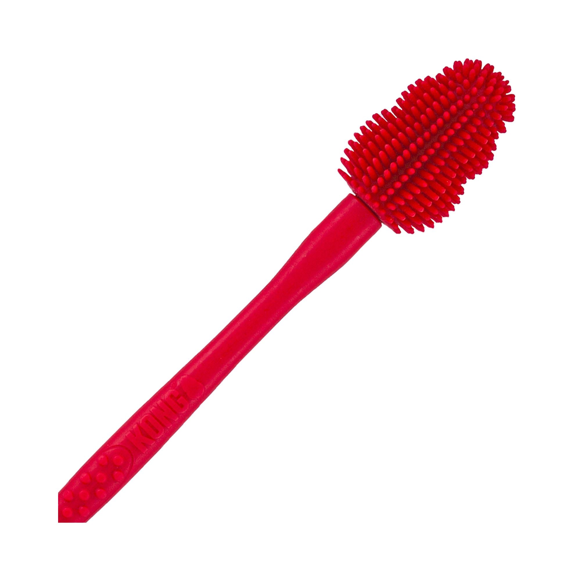 Close-up view of KONG Brush cleaning tool with silicone bristles