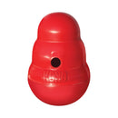 A large red KONG Wobbler Dog Treat Dispenser with a circular hole on the front and the embossed brand name KONG visible, isolated on a white background.