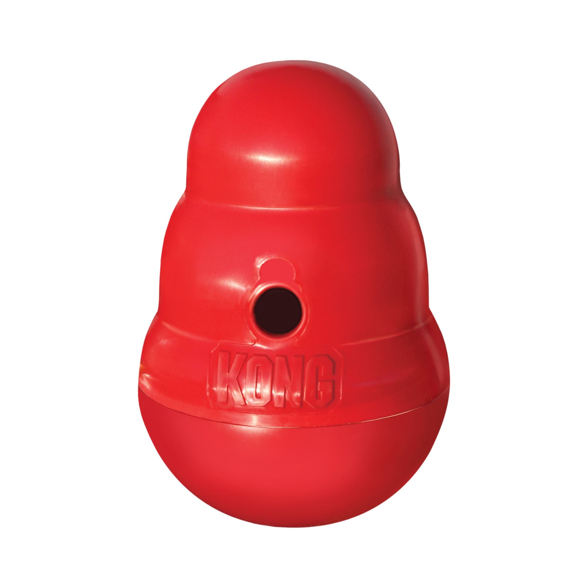A large red KONG Wobbler Dog Treat Dispenser with a circular hole on the front and the embossed brand name KONG visible, isolated on a white background.