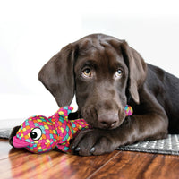 A playful dog joyfully interacts with a pink KONG Wubba Finz by grabbing onto the fish-shaped toy's - long floppy tails.