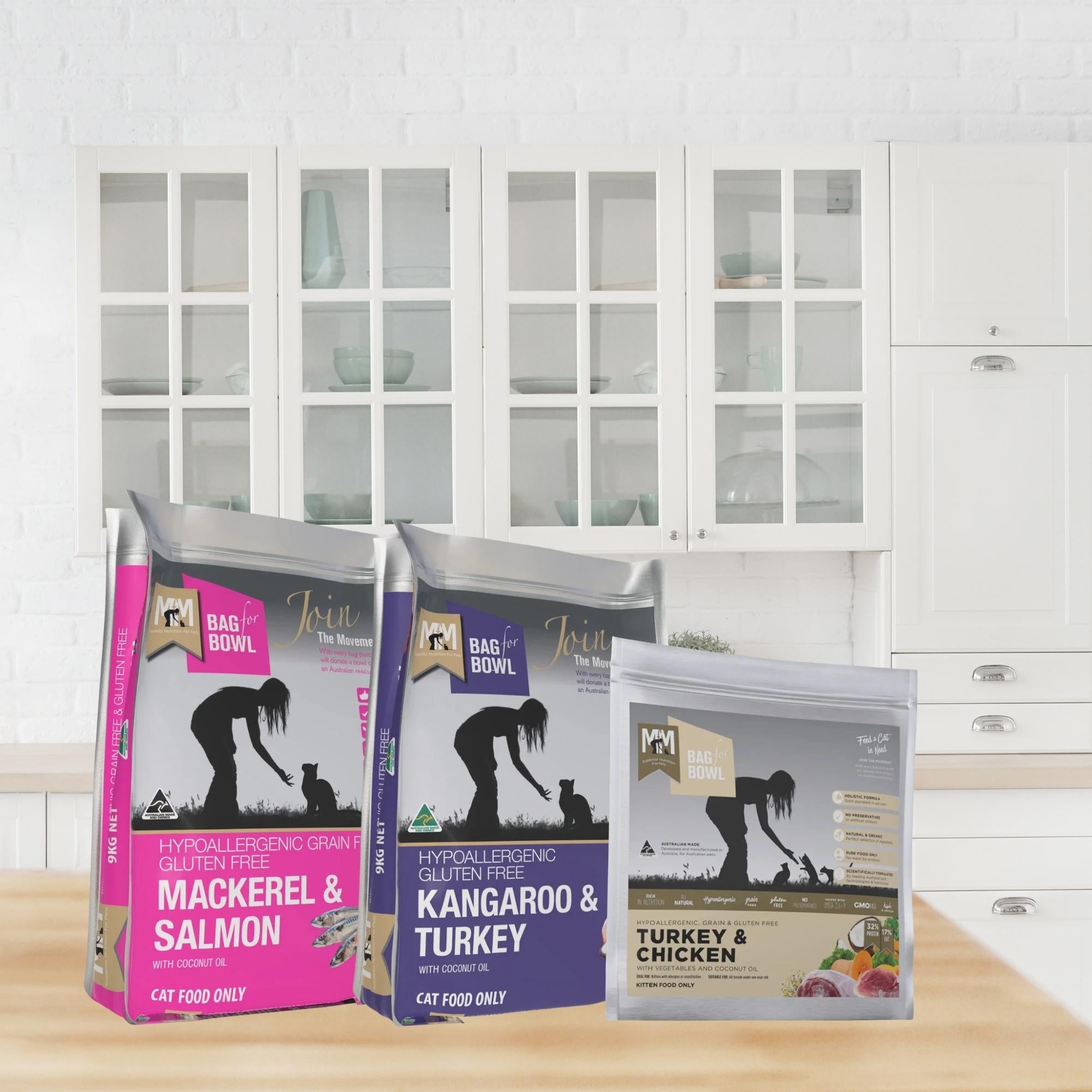 Meals for Meows hypoallergenic dry cat food bags on a wooden kitchen benchtop.
