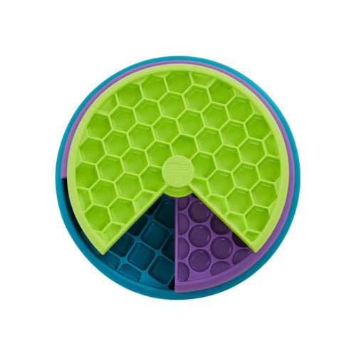Nina Ottosson Lickin' Layers dog puzzle game with three spinning layers in green, purple and blue, viewed from above