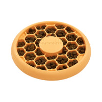 Outward Hound Catstages Cat Slow Feeder Bowl orange filled with dry food for cats.
