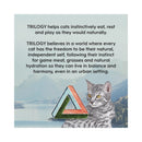 Cat sitting next to a triangular object with text about TRILOGY's beliefs for cats' well-being.