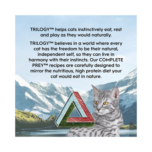 Cat sitting in front of a mountainous landscape with promotional text about TRILOGY cat food.