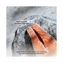 Raw wild-caught Alaskan salmon fillet on a stone surface, highlighting grain-free cat food ingredients