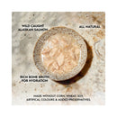 Bowl of wild-caught Alaskan salmon in bone broth, promoting hydration and grain-free recipe on a stone surface