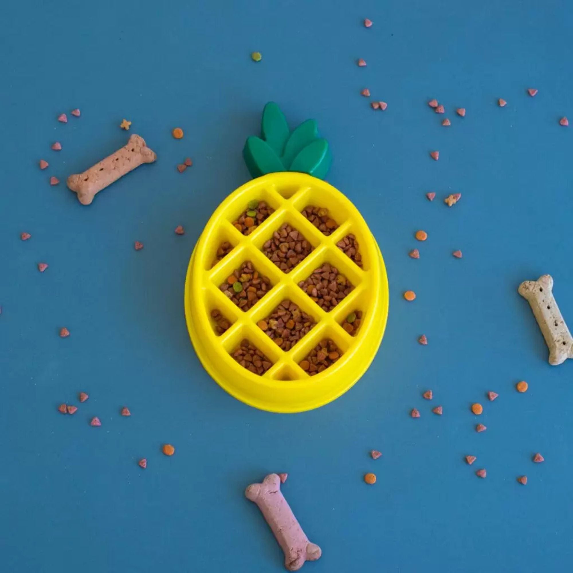 ZippyPaws Happy Bowl Pineapple slow-feed dog bowl filled with kibble, styled with dog treats