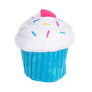 ZippyPaws NomNomz Cupcake plush dog toy in blue, with white frosting, embroidered sprinkles and a pink heart accent on top.