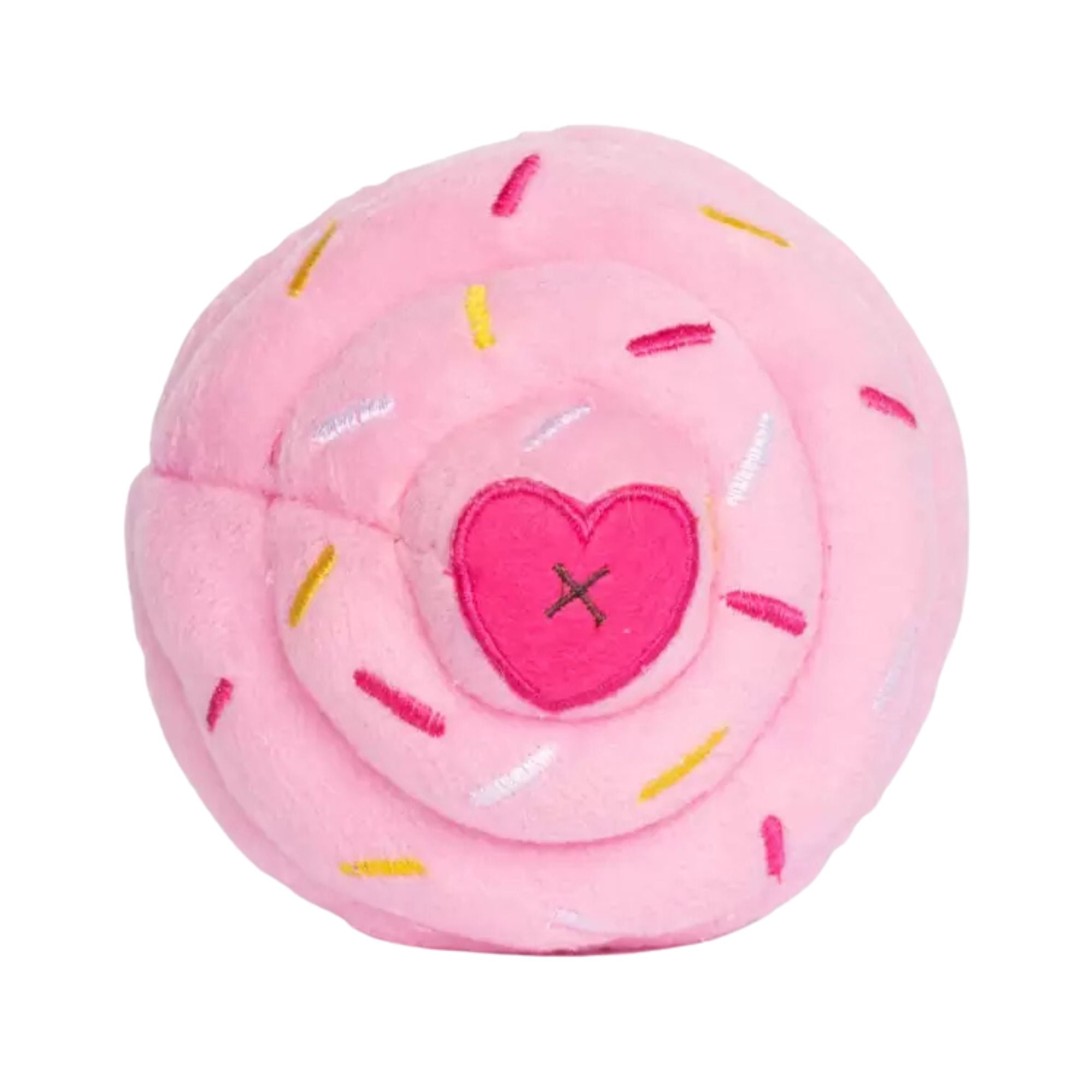 Top-down view of a pink plush cupcake dog toy with embroidered sprinkles and a pink heart in the centre.