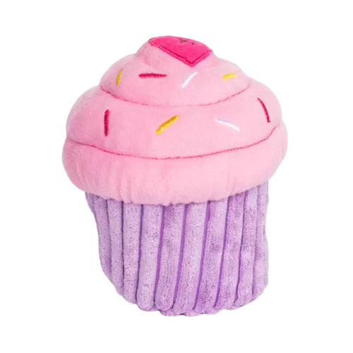 ZippyPaws NomNomz Cupcake plush dog toy in pink, with a textured purple base and pink frosting top featuring sprinkles and a heart accent.