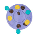 ZippyPaws SmartyPaws Puzzler in purple with kibble loaded into the slide, rotate and flip compartments