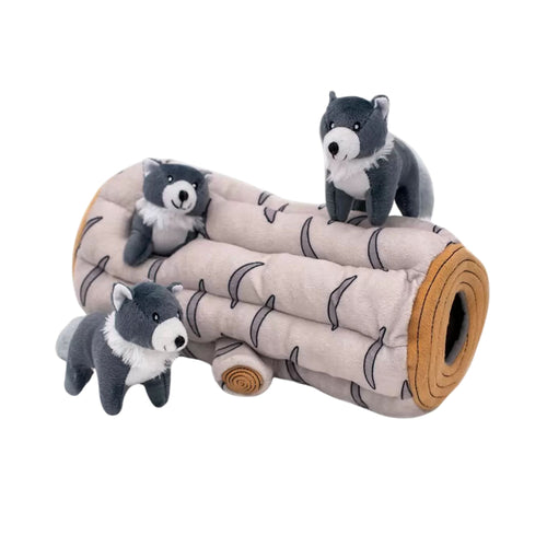 ZippyPaws Zippy Burrow Arctic Wolf log with two grey Arctic Wolf Miniz plush toys on top and one beside it