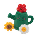 ZippyPaws Zippy Burrow Watering Can plush dog toy with a red flower peeking out of the green watering can, alongside a yellow sunflower and a white daisy squeaky flower.