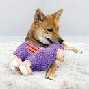 Dog enjoying playtime with a KONG Sherps Llama Plush Dog Toy.